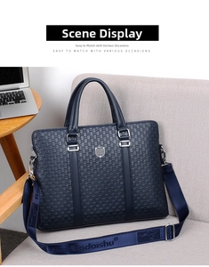Detail of navy business briefcase with geometric embossing and branded textile shoulder strap