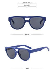 Detail view of stylish double bridge sunglasses in blue frame with dark lenses