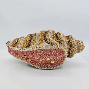 Luxury conch-shaped metal clutch bag with gold and pink rhinestones for evening gala