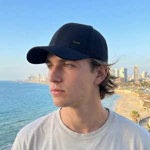 Minimalist black baseball cap with side gold Daria lettering and curved brim for men