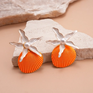 Detail of starfish stud earrings with white flower, pearl and orange shell drops