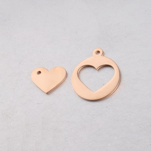 Detail of rose gold hollow heart and solid heart charms for DIY jewelry making