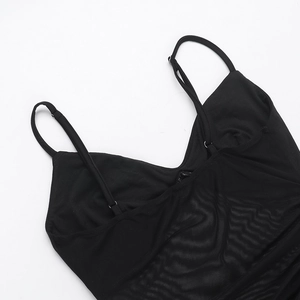 Close-up of black mesh dress featuring delicate thin straps and premium fabric texture