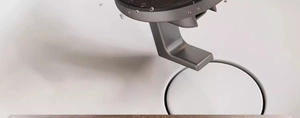 Detailed close-up of a silver matte suction hook showing waterproof metal texture with droplets