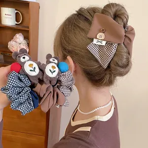 Plaid bow hair clip and bear scrunchie set in warm brown tones for girls