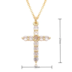 Detailed view of the gold cross pendant with dimensions 27mm by 18mm and clear zircon stones