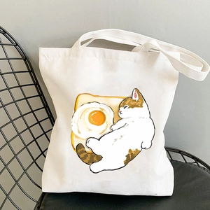 Kawaii cat print canvas tote bag featuring calico cat on toast illustration