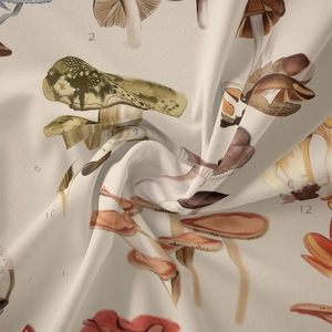 Detailed close-up of mushroom botanical illustration on soft beige bohemian fabric