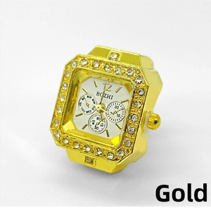 Detail of gold-plated ring watch featuring sparkling rhinestones and a white dial