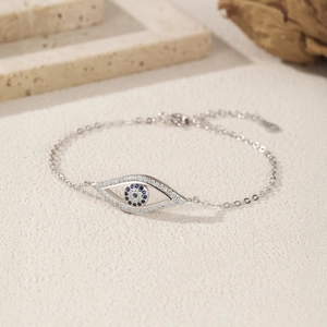 Elegant S925 sterling silver evil eye bracelet with blue zircons on textured stone