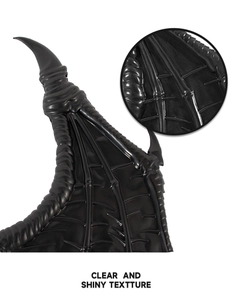 Macro detail of black dragon wings showing clear shiny leather texture and bone structure