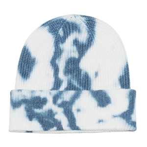 Close-up of blue and white tie-dye knit beanie with ribbed texture and fold-over cuff