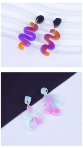 Detailed view of DIY resin epoxy earring molds showing snake and floral geometric shapes