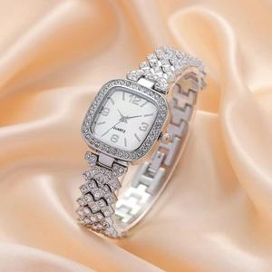 Fashion square quartz watch for women with rhinestones on a soft peach silk background