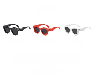 Three pairs of thick frame round sunglasses in black, red, and white with grey lenses