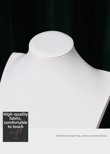 Detail of necklace display stand with thick sponge lining and white faux leather finish