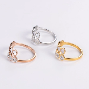 Detailed trio of fan-shaped shell rings in rose gold, silver, and gold plating