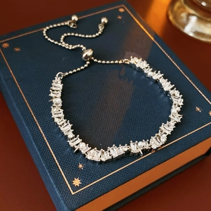 Detail of adjustable star pearl bracelet with cubic zirconia on premium navy gift box
