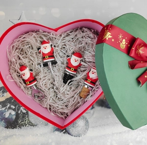 Christmas gift set featuring Santa Claus wine stoppers and openers in a heart-shaped box