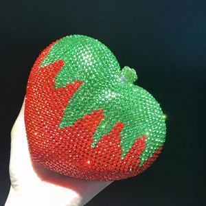 Sparkling strawberry heart evening bag encrusted with red and green rhinestones