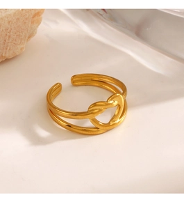 Close-up of 18K gold plated heart ring with double-layered band on white stone