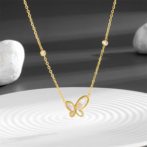 Elegant gold butterfly necklace with shimmering mother of pearl and zircon accents