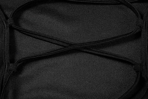 Macro shot of backless criss-cross tie-up details on a black satin summer dress