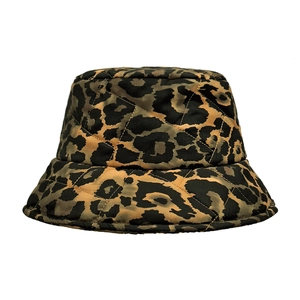 Detail of leopard print bucket hat showing diamond quilting and satin-like texture