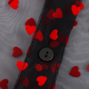 Sheer black mesh blouse with red heart patterns and ruffle sleeves detailing
