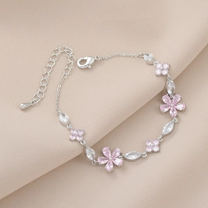 Detail of flower bracelet with pink zircon petals and adjustable lobster clasp