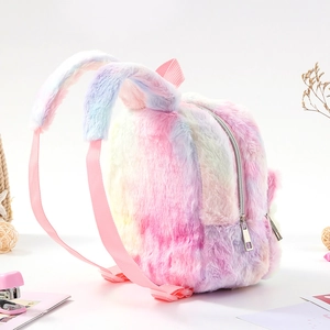 Detail of plush backpack showing macaron gradient faux fur and cute bunny ears