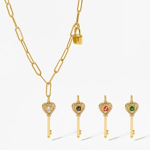 Golden heart key pendant necklace with colorful gemstones and crystal pavé details