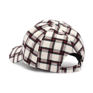 Close-up of the metal buckle adjustment and classic tartan plaid texture on baseball cap