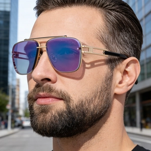 Detail of pilot-style sunglasses with gold double-bridge frame and purple gradient lenses