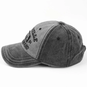 Close-up of vintage washed baseball cap with ILLE 84 FORWARD embroidery patch and stitching