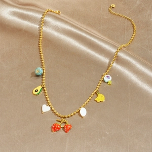 Colorful fruit pendant necklace with strawberry and avocado charms on gold beaded chain