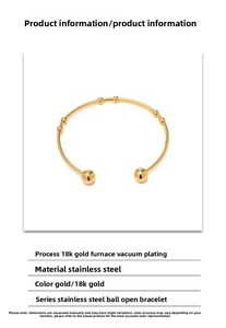 Macro shot of 18K gold plated stainless steel open bangle with spherical ends