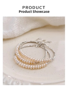 Detail of s925 silver multilayer bracelet with pink freshwater pearls and silver beads