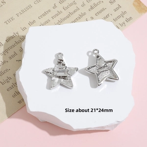 Detailed view of 21x24mm silver star pendants with rectangle zircon and metal texture