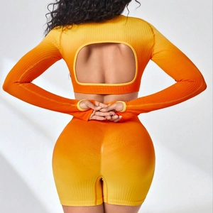 Seamless ribbed two-piece yoga set with backless long sleeve top and shorts in orange gradient