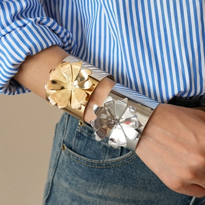Exaggerated large flower cuff bracelet in polished gold and silver metallic finish
