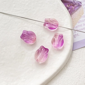 Macro shot of purple gradient tulip glass beads for DIY jewelry and necklace crafts