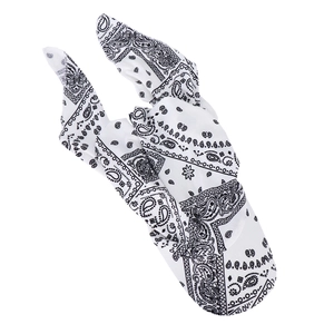 Close-up of white paisley fabric headscarf featuring detailed black floral patterns