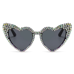 Vintage heart-shaped sunglasses with iridescent rhinestones and dark grey lenses