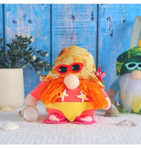 Detail of summer gnome plush with orange beard, red sunglasses, and beach accessories