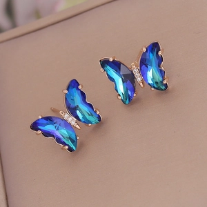 Blue gradient butterfly stud earrings with crystal wings and gold-plated finish