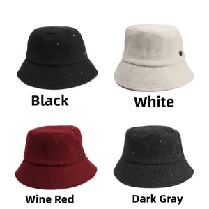 Detail of wool blend bucket hats in four colors with sequins and metal logo detail