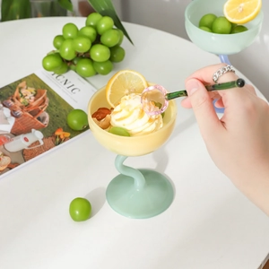 Glass sundae cup with yellow bowl and green twisted stem, plus matching glass spoon