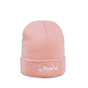 Detailed close-up of pink knitted beanie with white MEOW embroidery and cat whisker design