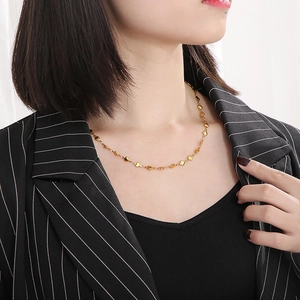 Minimalist gold heart-shaped link necklace for women shown on a fashion model